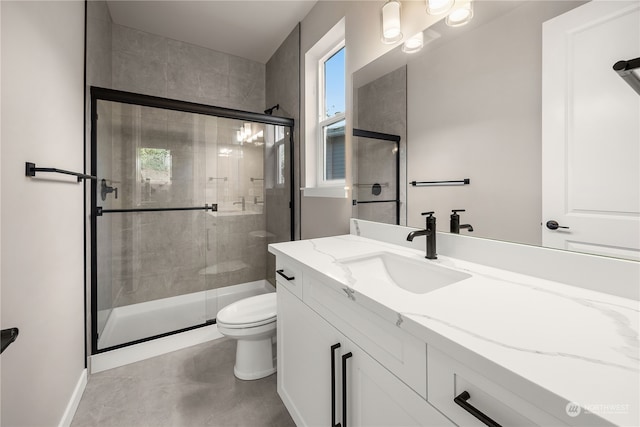 bathroom with vanity, toilet, and walk in shower