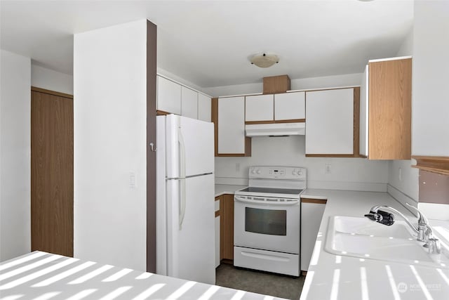 kitchen with sink and white appliances