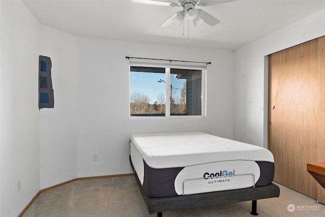 bedroom with light colored carpet and ceiling fan