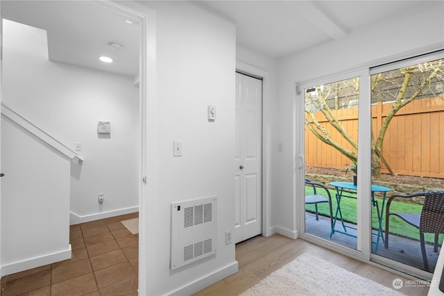 entrance foyer featuring hardwood / wood-style flooring and heating unit