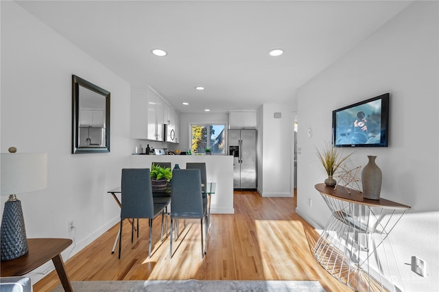 dining space featuring light hardwood / wood-style floors