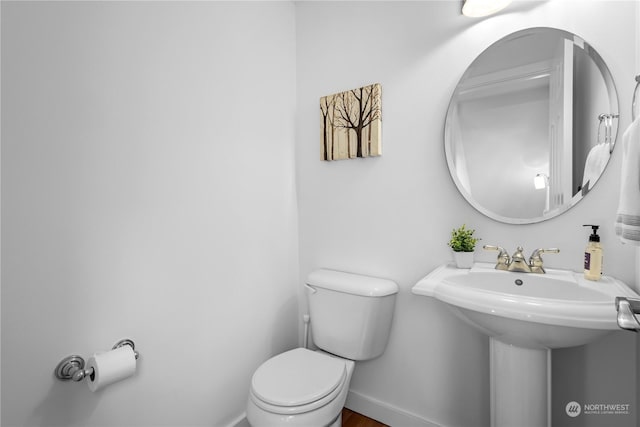 bathroom featuring sink and toilet