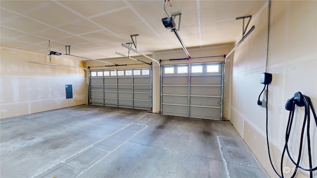 garage featuring a garage door opener and electric panel