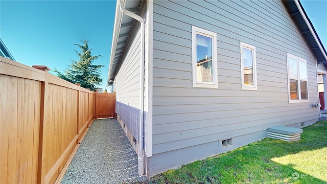 view of home's exterior with a yard