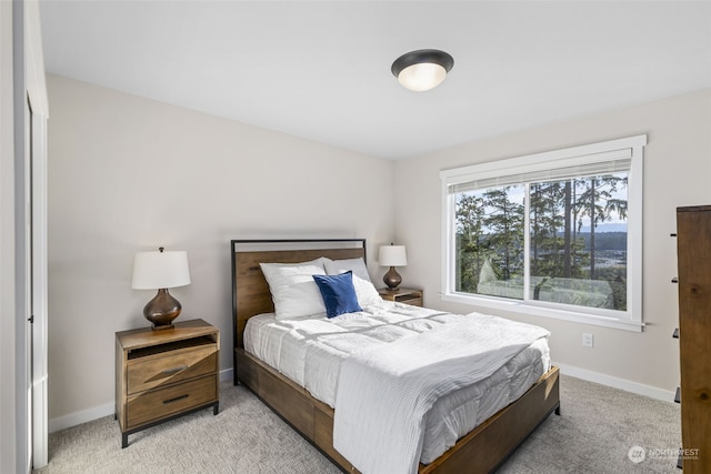 bedroom featuring light colored carpet