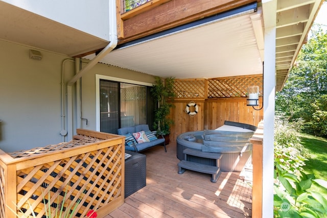 wooden terrace with outdoor lounge area