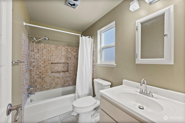 full bathroom with vanity, tile patterned floors, toilet, and shower / tub combo with curtain