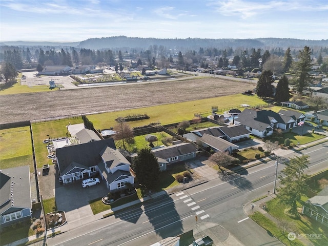 birds eye view of property with a mountain view