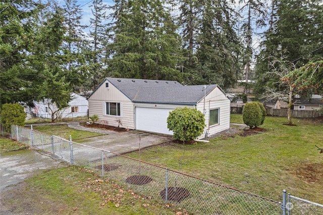 back of house with a garage and a lawn