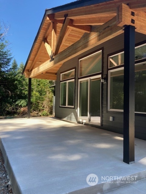 view of side of property featuring a patio