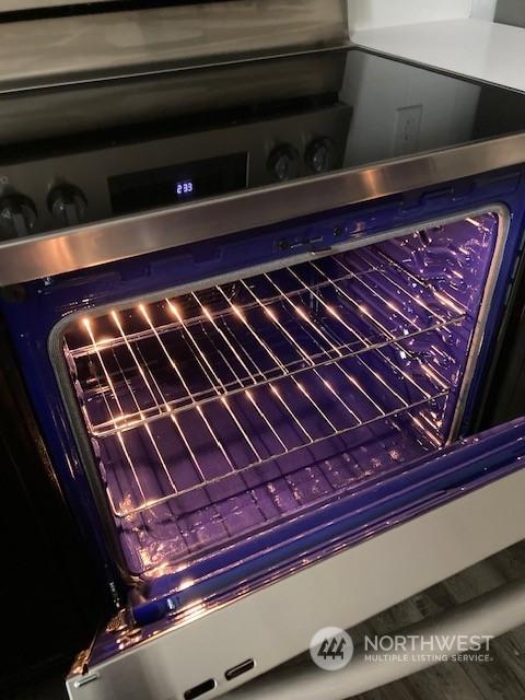 interior details featuring stainless steel range with electric stovetop