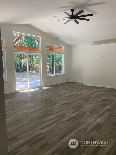 unfurnished living room featuring lofted ceiling, dark wood-type flooring, and ceiling fan