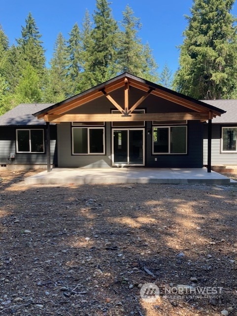 rear view of house featuring a patio