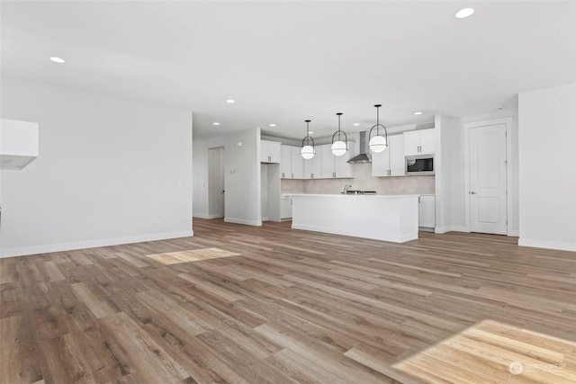 unfurnished living room featuring light hardwood / wood-style flooring