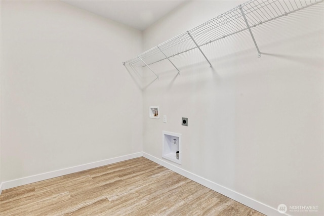 7157 91st St E, Puyallup, WA 98371 - laundry room with baseboards, washer hookup, hookup for an electric dryer, and light wood-style flooring
