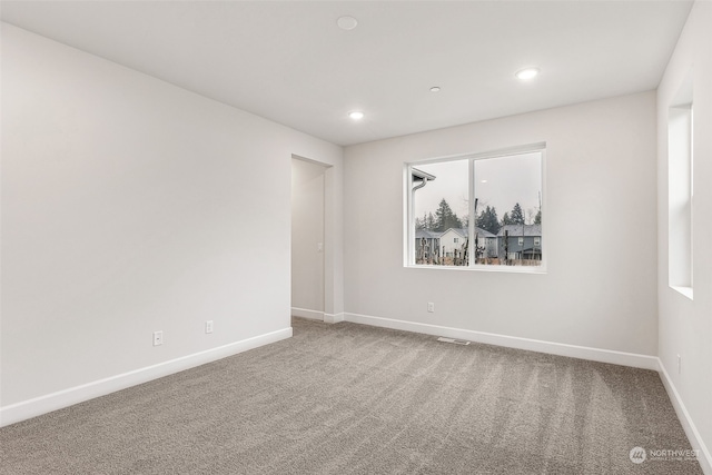 empty room with carpet flooring