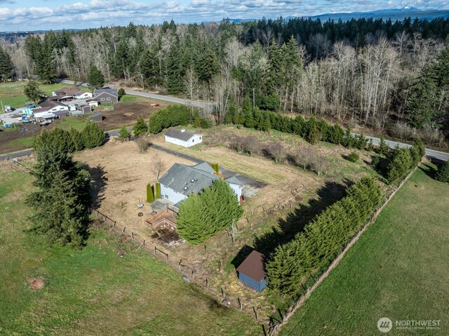 bird's eye view featuring a wooded view