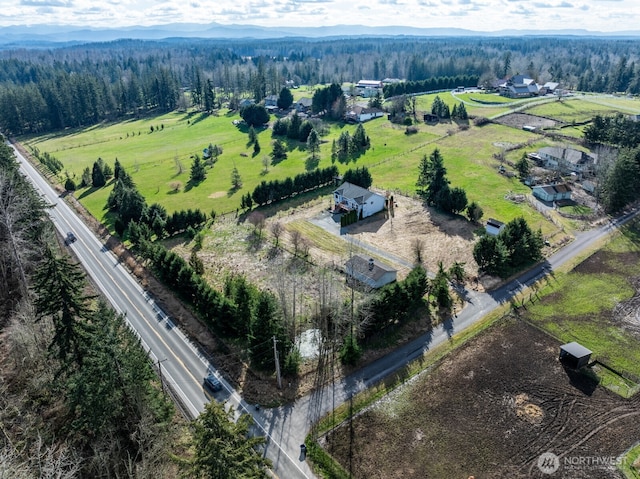 aerial view featuring a mountain view, a rural view, and a forest view