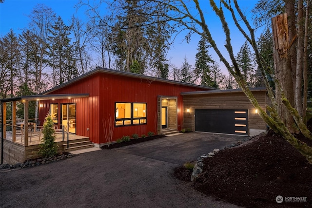 view of front of property featuring a garage and a porch