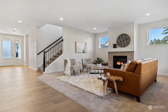 living room with a wealth of natural light and light hardwood / wood-style floors