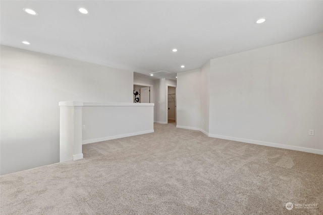 empty room with light colored carpet