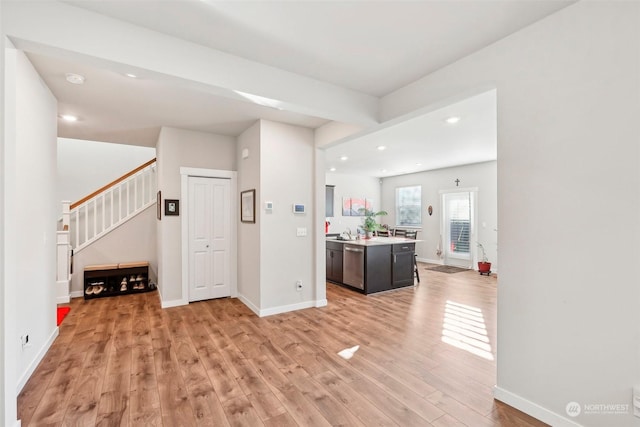 interior space featuring sink and light hardwood / wood-style floors