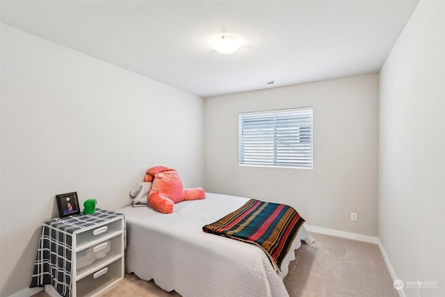 bedroom with light carpet