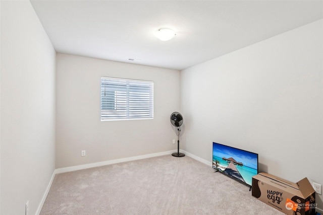 misc room featuring light colored carpet