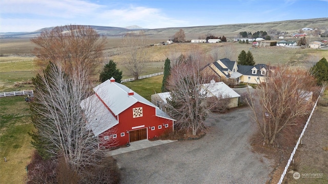 aerial view with a mountain view and a rural view