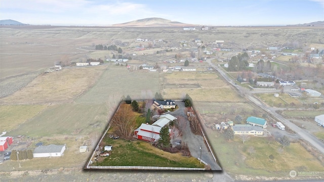 birds eye view of property featuring a mountain view