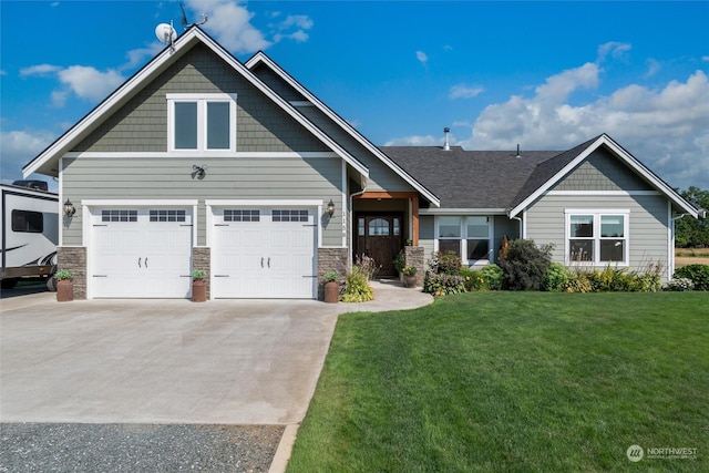 craftsman-style house featuring a garage and a front lawn