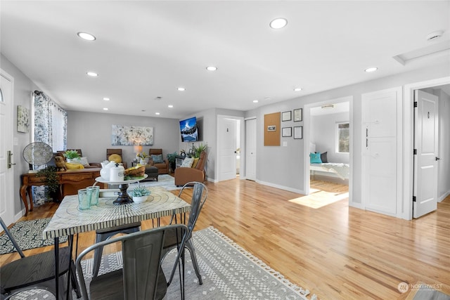 dining area with light hardwood / wood-style floors