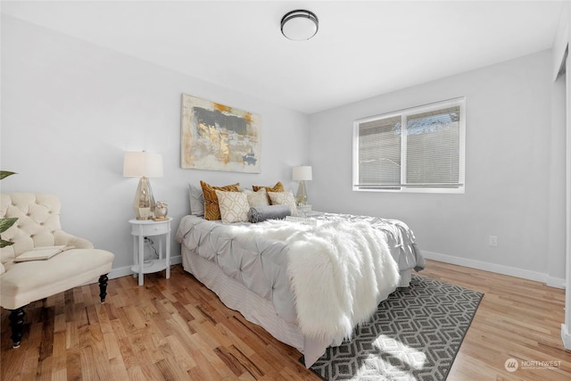 bedroom with hardwood / wood-style floors