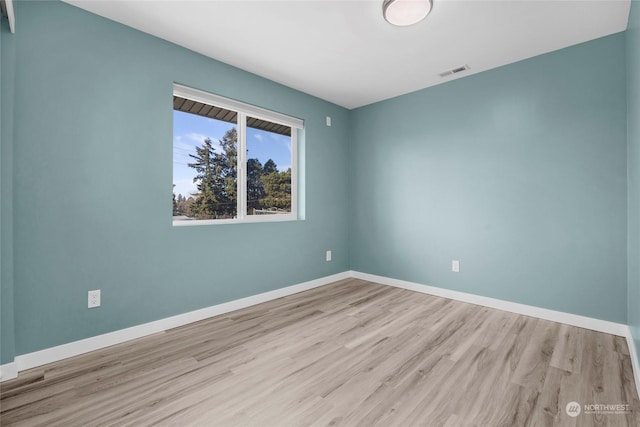 empty room featuring light hardwood / wood-style floors