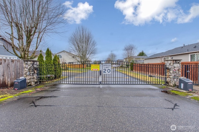 view of gate featuring fence