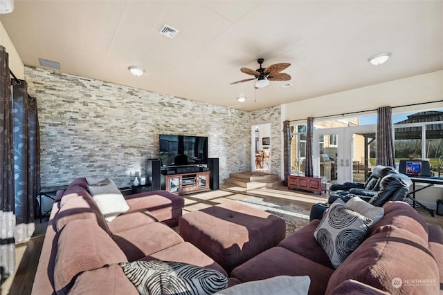 living room featuring hardwood / wood-style flooring, french doors, and ceiling fan