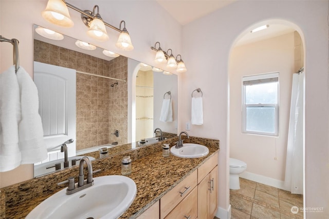 full bathroom featuring tile patterned flooring, vanity, shower / tub combo, and toilet