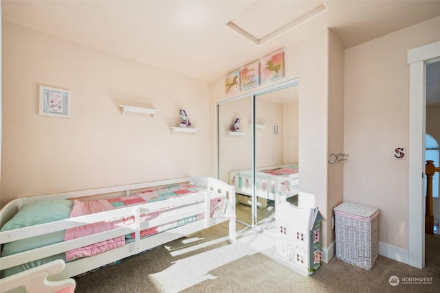 bedroom with carpet and a closet