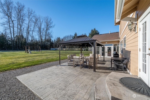 view of patio with a gazebo and a playground