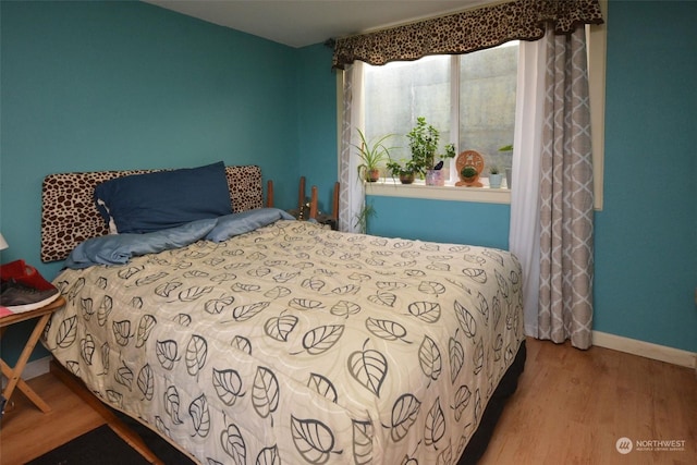 bedroom featuring hardwood / wood-style floors