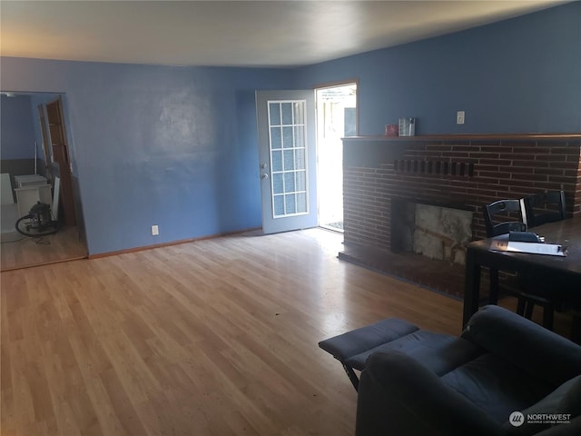 living room featuring hardwood / wood-style flooring and a fireplace