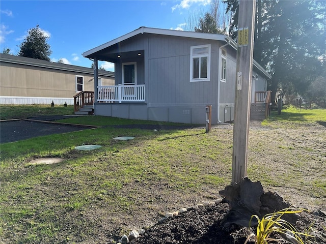 view of property exterior with a yard