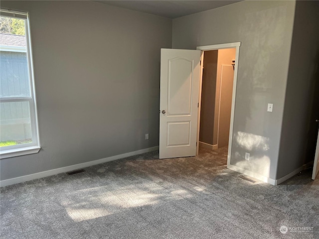 unfurnished room with carpet floors