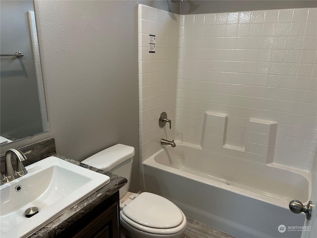 full bathroom featuring vanity, shower / tub combination, and toilet