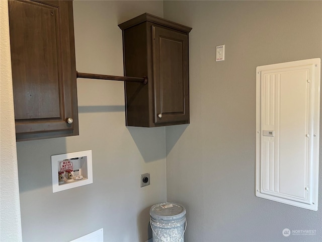 laundry room with hookup for a washing machine, hookup for an electric dryer, electric panel, and cabinets