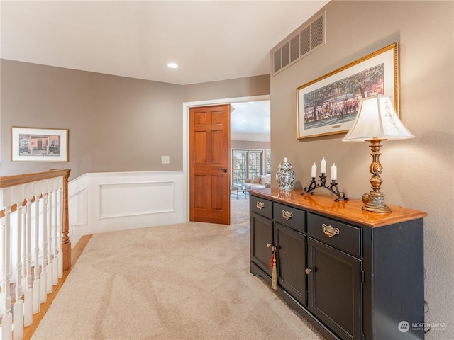 hallway with light carpet