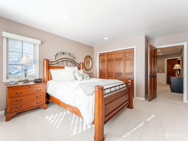 carpeted bedroom featuring a closet