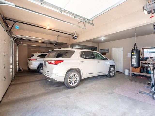 garage featuring a garage door opener