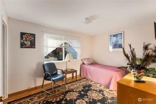 bedroom featuring wood-type flooring