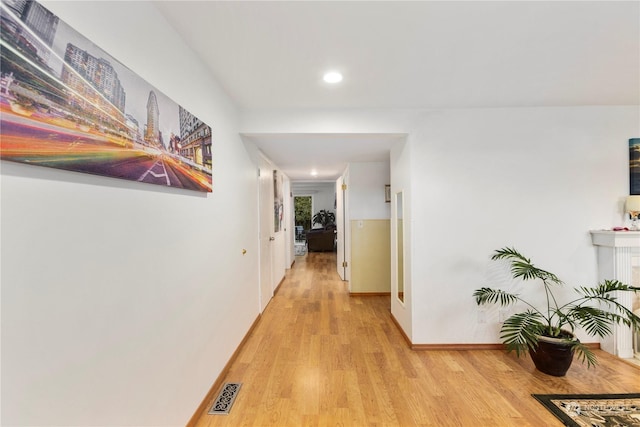 corridor featuring light hardwood / wood-style flooring